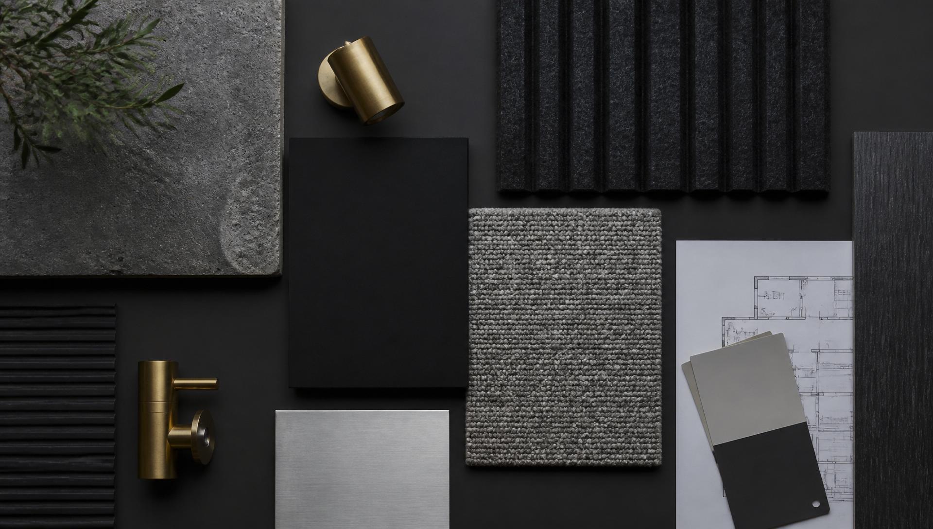 Material mood board with charcoal, black laminate, grey carpet, and brass accent